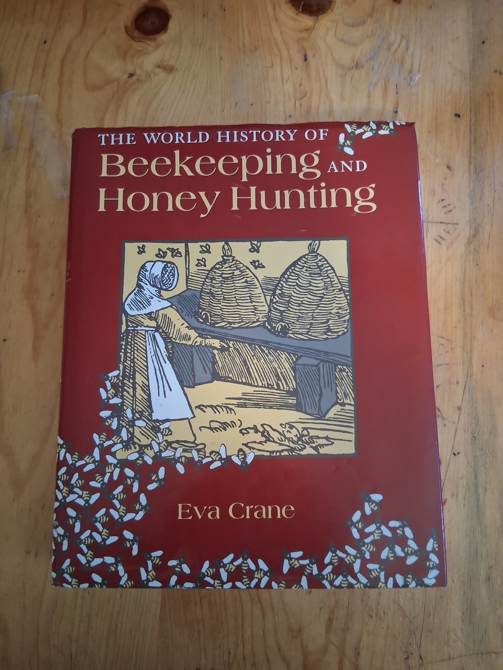 The World History of Beekeeping and Honey Hunting by Eva Crane - Red Cover